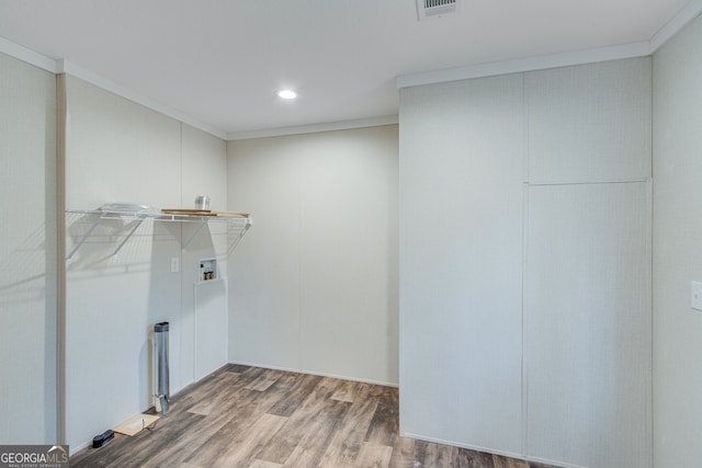 laundry room with ornamental molding, laundry area, hookup for a washing machine, and wood finished floors