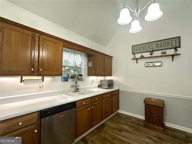 kitchen featuring lofted ceiling, sink, decorative light fixtures, dark hardwood / wood-style floors, and dishwasher