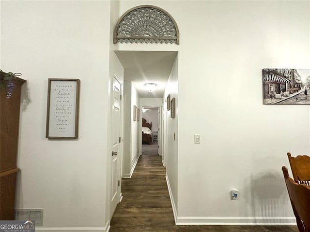 corridor with dark wood-type flooring