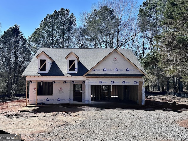 property under construction featuring a garage and driveway