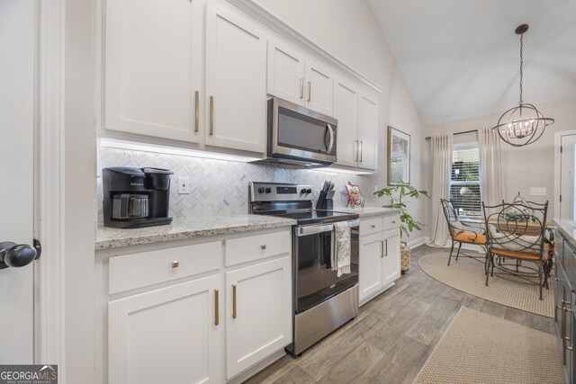 kitchen featuring white cabinetry, visible vents, appliances with stainless steel finishes, and a sink