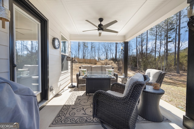 view of patio / terrace featuring a ceiling fan and an outdoor living space