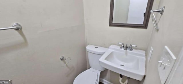 bathroom with sink and toilet