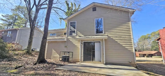 rear view of house featuring a patio