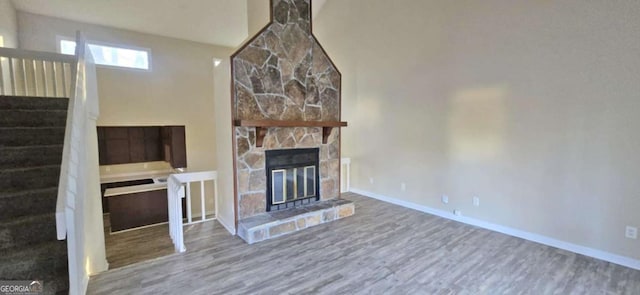 unfurnished living room with hardwood / wood-style floors and a fireplace