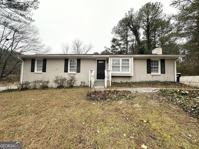 29 Hickory Ct, Dallas, GA 30157 - ranch-style house with brick siding, a chimney, and a front yard