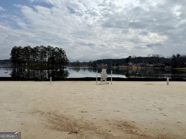 view of community with a water view