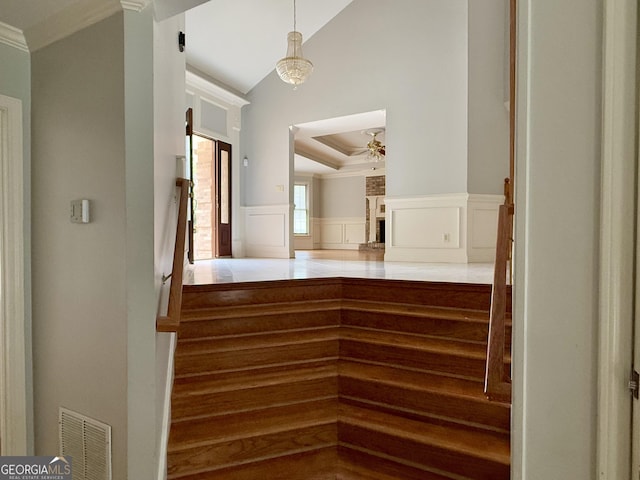 stairs with crown molding