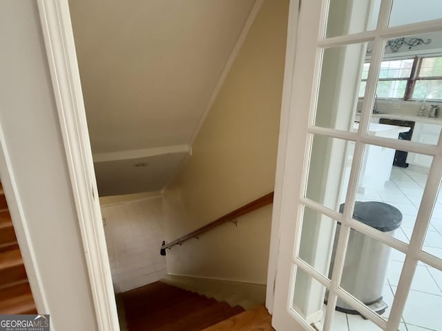 staircase featuring tile patterned flooring