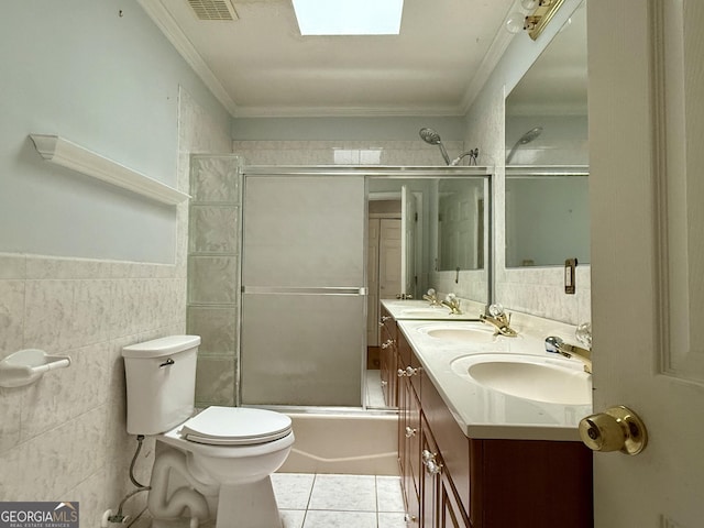 full bathroom featuring tile walls, enclosed tub / shower combo, ornamental molding, toilet, and tile patterned floors