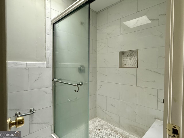 bathroom featuring an enclosed shower