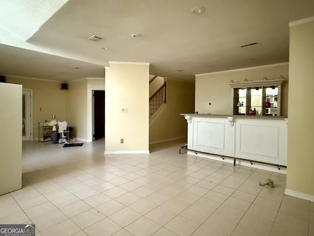 tiled empty room with ornamental molding