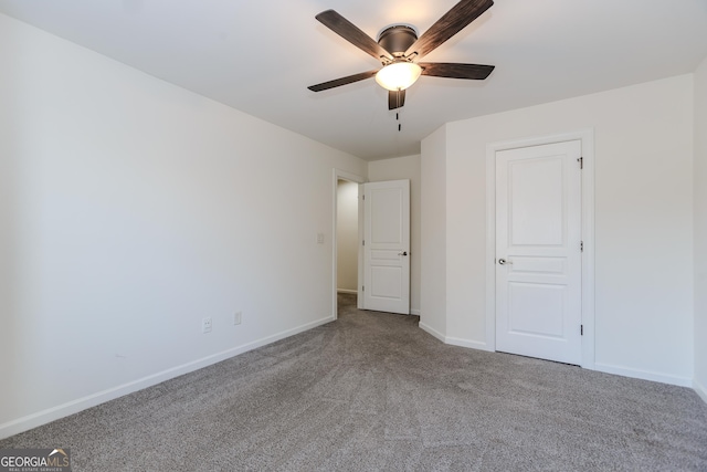 unfurnished bedroom with ceiling fan and carpet