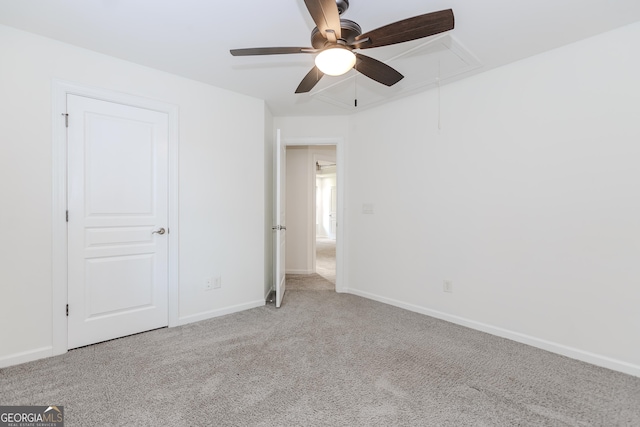 unfurnished bedroom featuring light carpet and ceiling fan