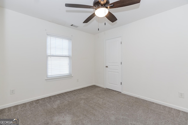 carpeted empty room with ceiling fan