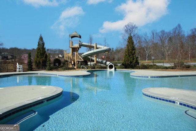 view of pool with a water slide