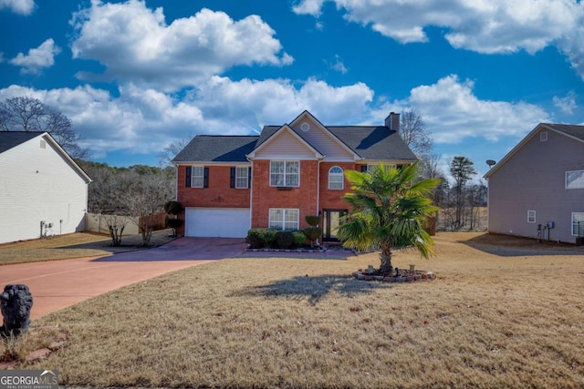 view of front of house featuring a garage and a front yard