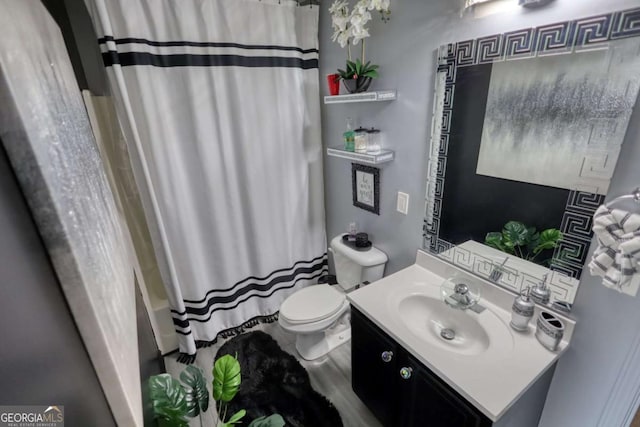 full bathroom with vanity, toilet, and shower / tub combo with curtain