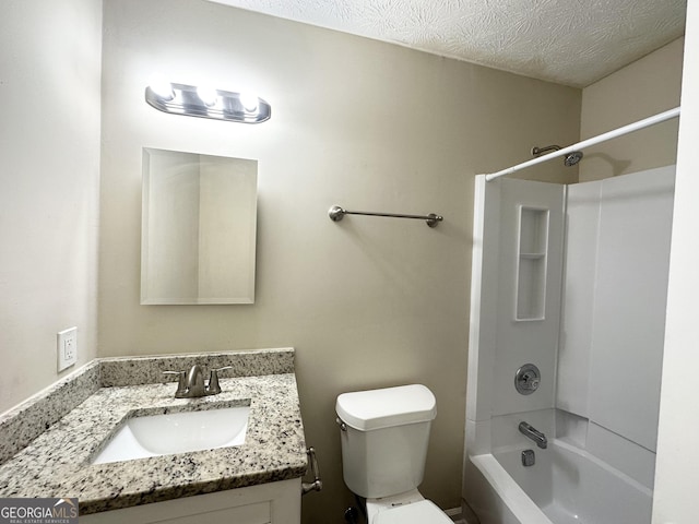 full bathroom featuring vanity, toilet, a textured ceiling, and shower / bath combination