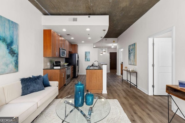 living room featuring dark hardwood / wood-style floors and sink