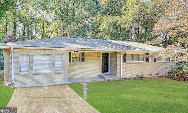 ranch-style home featuring a front yard