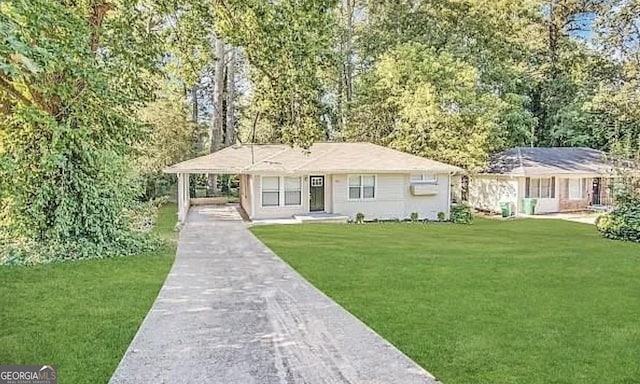 ranch-style house with a carport and a front yard