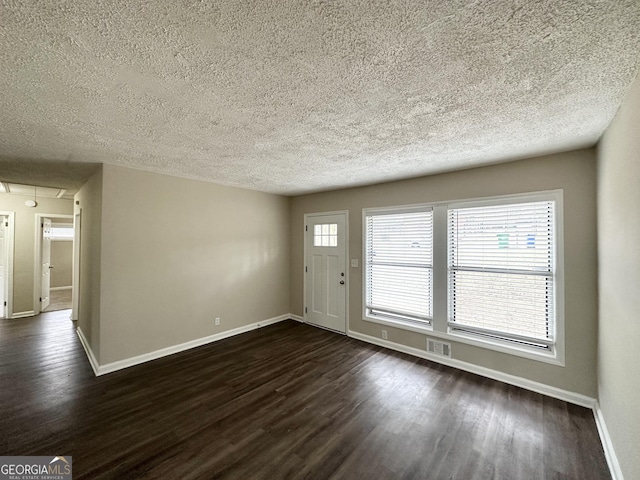 1785 San Gabriel Ave, Decatur, GA 30032 - foyer entrance featuring dark wood-type flooring and a textured ceiling