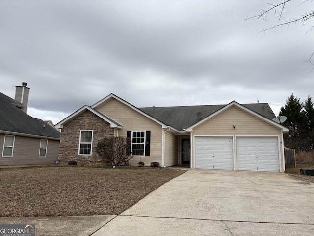 ranch-style home featuring a garage