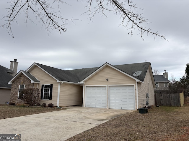 ranch-style house featuring a garage