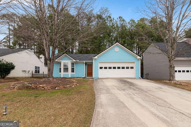 view of front of property with a garage and a front yard