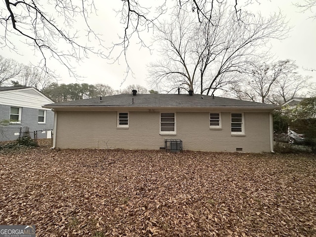 back of property featuring central AC unit