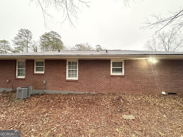 back of property featuring central air condition unit