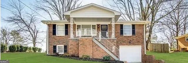 view of front of home featuring a garage and a front lawn