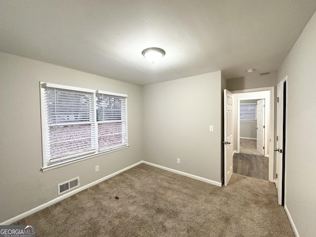 empty room with carpet flooring