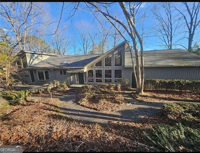 back of property featuring a sunroom