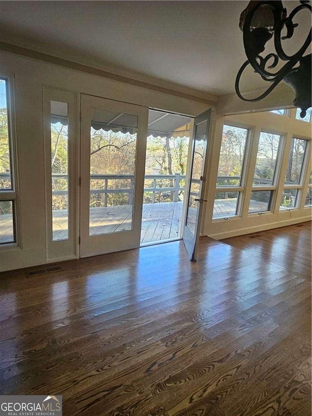 entryway with dark hardwood / wood-style flooring