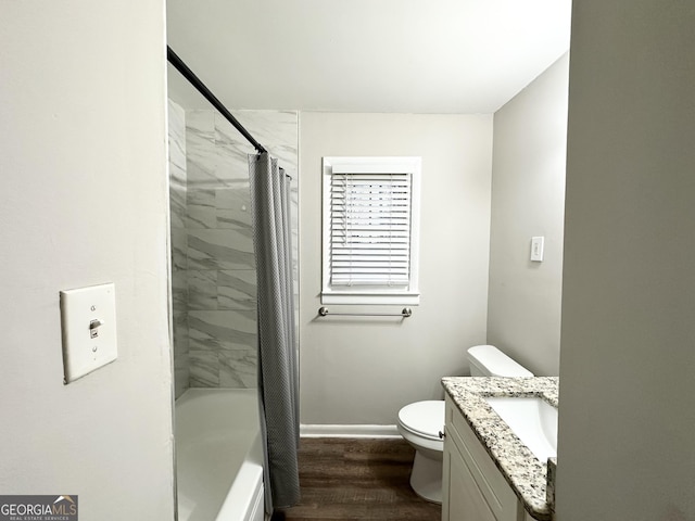 full bathroom featuring vanity, hardwood / wood-style floors, shower / bathtub combination with curtain, and toilet