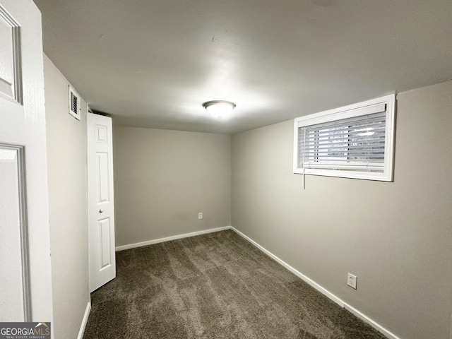 basement with dark carpet