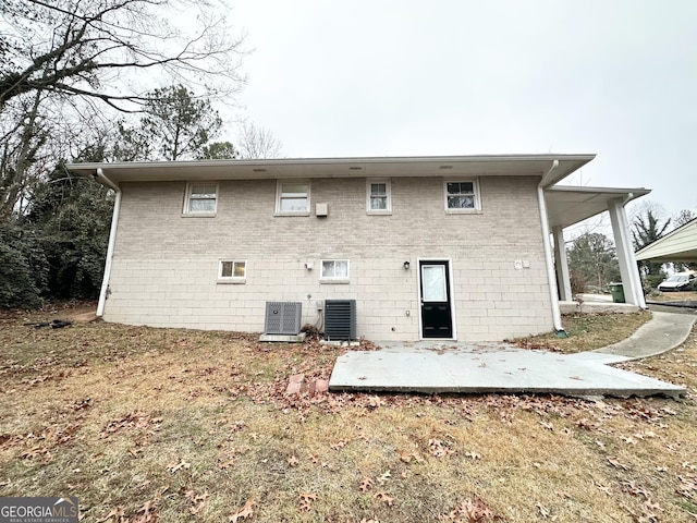 back of property featuring a patio and central air condition unit