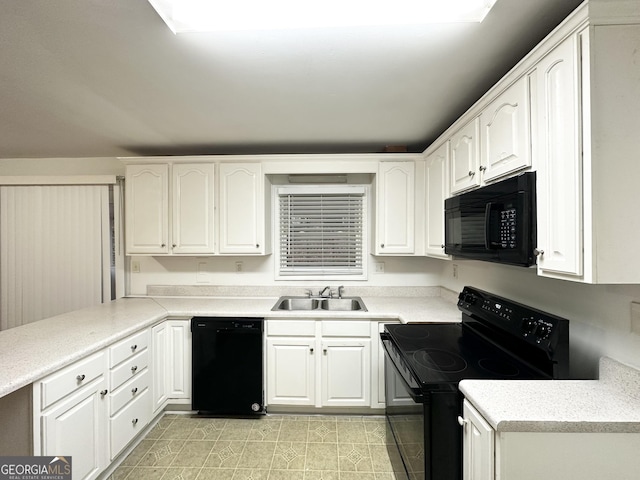 kitchen featuring white cabinetry, sink, and black appliances