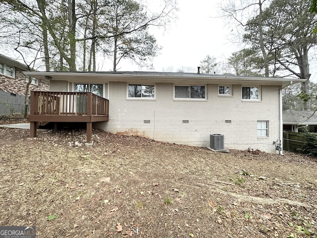 rear view of property with a deck and central air condition unit