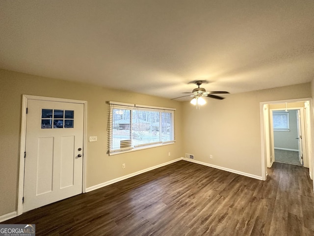 foyer entrance featuring dark hardwood / wood-style floors and ceiling fan