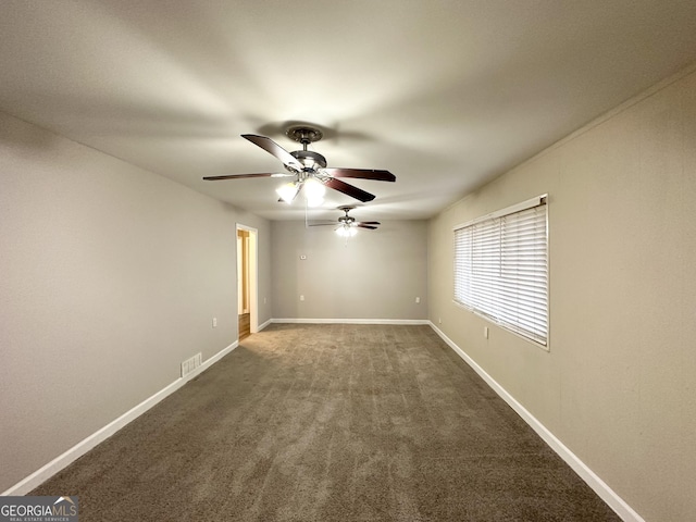 carpeted empty room featuring ceiling fan