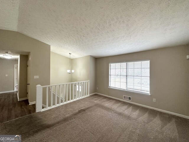 4305 Old Lake Dr, Decatur, GA 30034 - spare room with lofted ceiling, a textured ceiling, and carpet