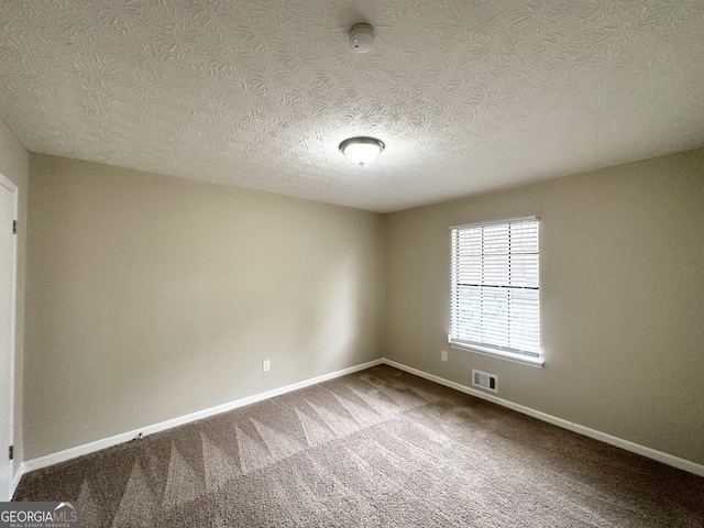 spare room with carpet flooring