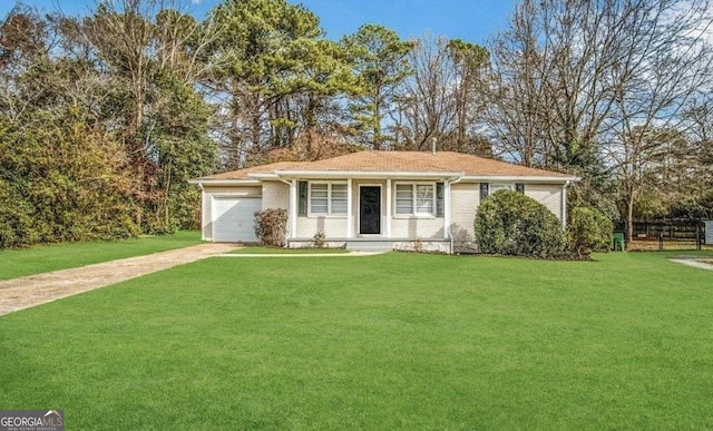 single story home featuring a garage and a front lawn