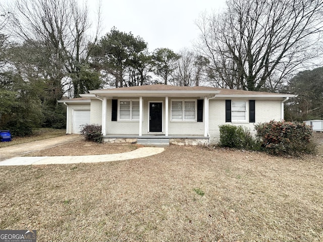 view of front of home featuring a garage and a porch