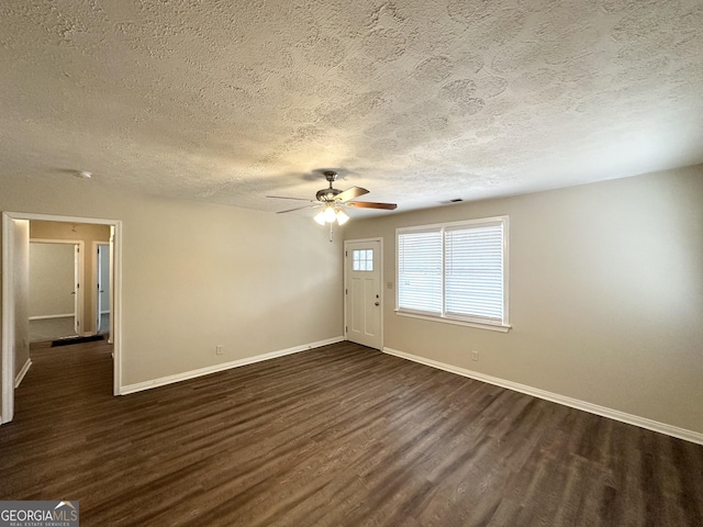 1756 Lynn Ln, Decatur, GA 30032 - empty room with dark wood-type flooring, a textured ceiling, and a ceiling fan