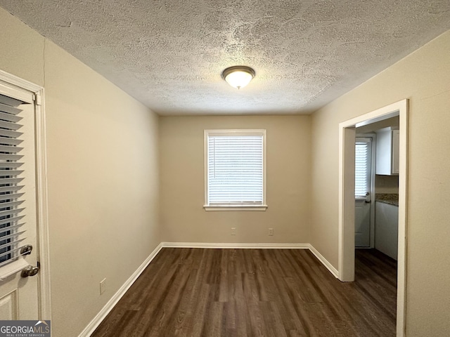 1756 Lynn Ln, Decatur, GA 30032 - unfurnished room featuring dark hardwood / wood-style flooring and a textured ceiling