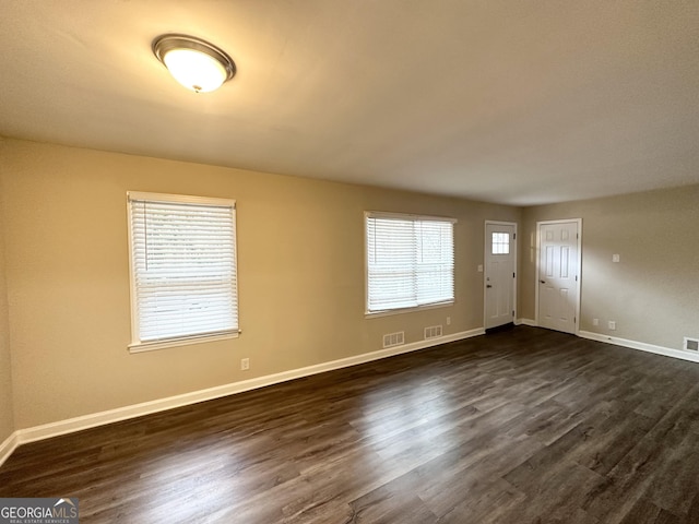 foyer with dark hardwood / wood-style floors